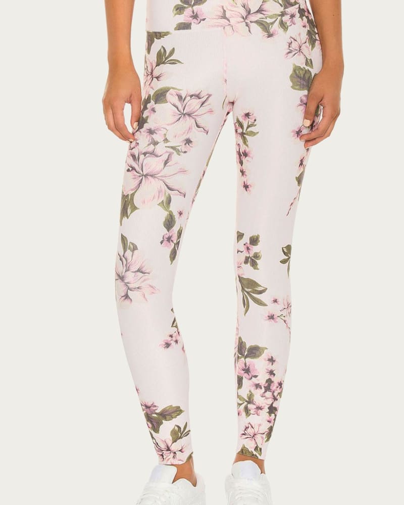 Front of a model wearing a size XL Piper Legging in Pink Floral in Pink Floral by Beach Riot. | dia_product_style_image_id:338743